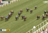 Horse race at Royal Ascot on a grassy track, a pack of jockeys riding horses close together, spectators along the white railing, with on-screen overlays: Live, 3.05 Royal Ascot, 6f, time 01:05.48, speed 38 mph, Sky Sports Racing logo