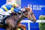Jockeys in blue and yellow silks race a dark brown horse toward the finish at Belmont Park, blue banner in background