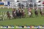 Group of racehorses and jockeys sprinting on a turf track; on-screen Ipswich R7 graphic shows 800m to go and time 1:57.93.