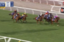 Horses racing on a turf track in a live broadcast; a leading horse with a pink cap on the right, others close behind, timer reads 1:03.99 and 160m to go.