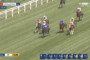 Jockeys race on a grassy track during a live horse race at Royal Ascot, with on-screen live banner and time.