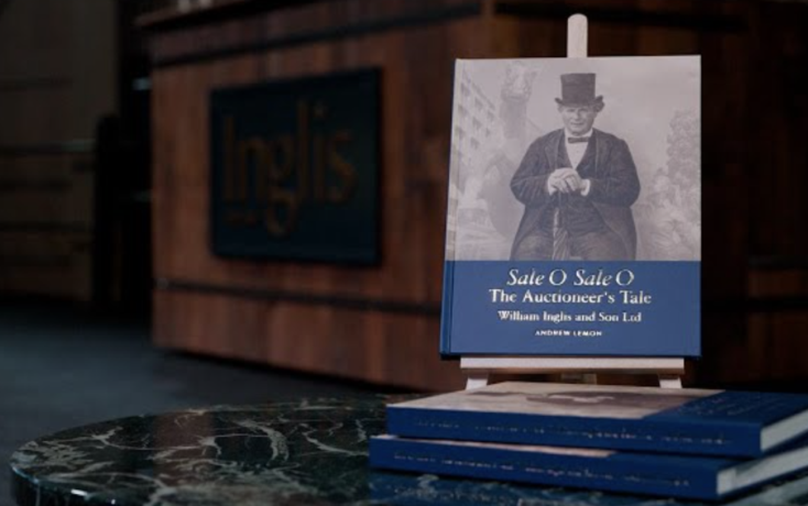 Book cover on a stand: 'Sale O Sale O: The Auctioneer's Tale' by William Inglis & Son Ltd.